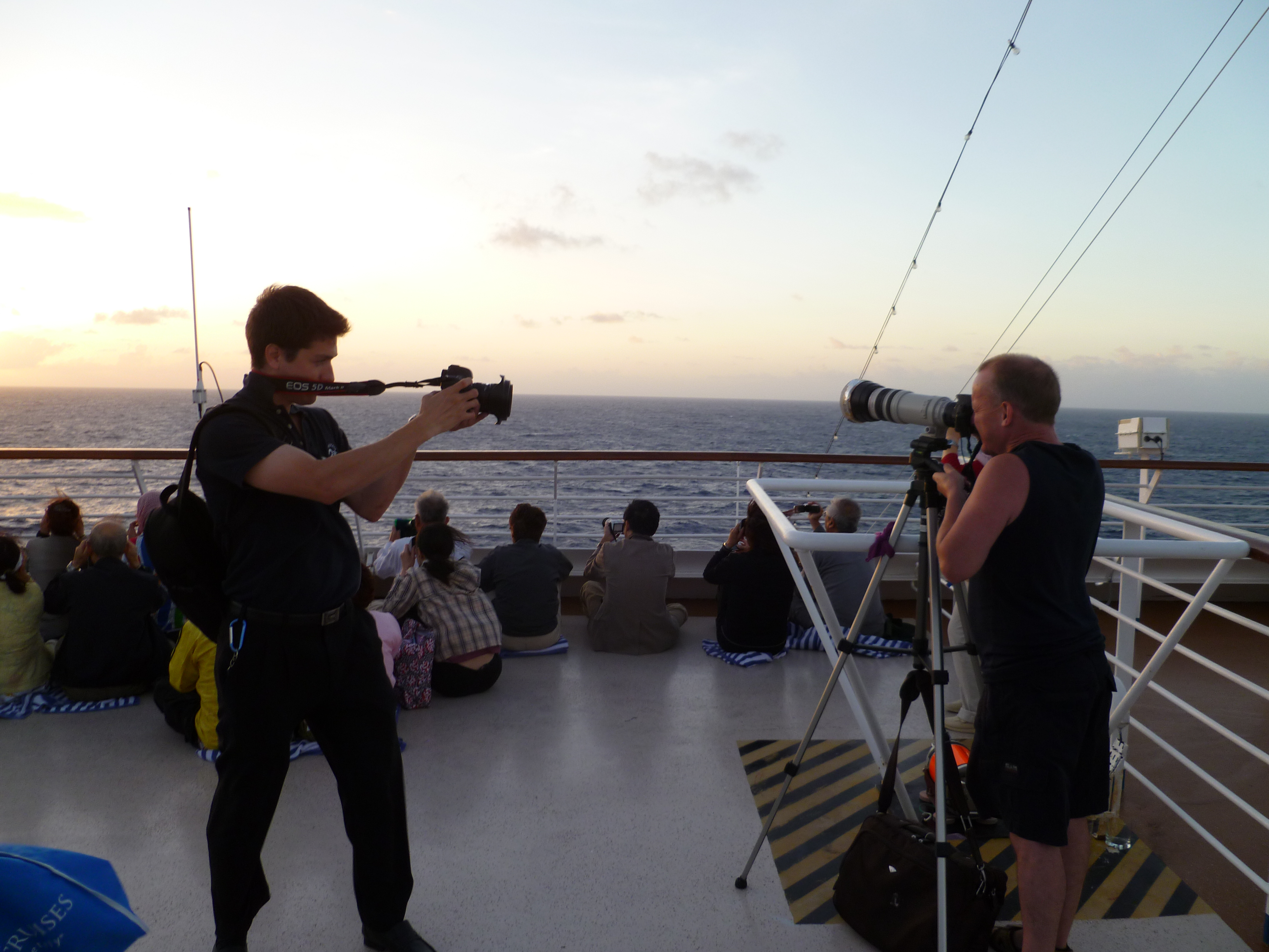 Lenses at dawn! Actually Phill is posing while the boy is taking a video!